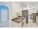 Kitchenette adjacent to kitchen featuring stylish countertop and stainless steel refrigerator at 504 E Lee St, Plant City, FL 33563
