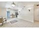 Open living room featuring neutral tile flooring and ceiling fans for comfort at 504 E Lee St, Plant City, FL 33563