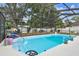 Inviting screened-in pool area perfect for relaxation and entertainment at 504 E Lee St, Plant City, FL 33563
