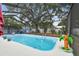 Serene screened-in pool area with lush green surroundings at 504 E Lee St, Plant City, FL 33563