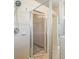 Bathroom showcasing a walk-in shower stall with glass door and a view to the walk-in closet at 5205 Lansdowne Way, Palmetto, FL 34221