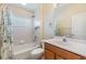A bathroom featuring a vanity, sink, toilet, mirror, and a bathtub with a shower at 5205 Lansdowne Way, Palmetto, FL 34221