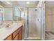 Bathroom featuring a single sink, a walk-in shower stall, and a walk-in closet at 5205 Lansdowne Way, Palmetto, FL 34221