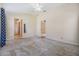 Bedroom featuring neutral walls, carpeted floor, a ceiling fan, and view to the en suite bathroom at 5205 Lansdowne Way, Palmetto, FL 34221