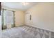 Bedroom featuring a ceiling fan, carpeted floor, white walls, and a window with curtains at 5205 Lansdowne Way, Palmetto, FL 34221