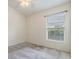 Bedroom featuring a ceiling fan, carpeted floor, white walls, and a large window at 5205 Lansdowne Way, Palmetto, FL 34221