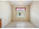 Cozy dining area with tile floors, chandelier lighting, and a bright window at 5205 Lansdowne Way, Palmetto, FL 34221