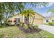 Charming single-story home with a well-manicured lawn and vibrant landscaping at 5205 Lansdowne Way, Palmetto, FL 34221