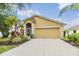 Well maintained single story home with manicured front yard and two car garage at 5205 Lansdowne Way, Palmetto, FL 34221