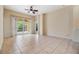 Bright living room with tiled floor that leads to the screened lanai at 5205 Lansdowne Way, Palmetto, FL 34221