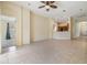 Spacious open-concept living room with tile floors, access to multiple rooms, and natural light at 5205 Lansdowne Way, Palmetto, FL 34221