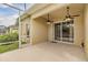 Covered and screened lanai featuring dual ceiling fans and sliding glass doors into the main house at 5205 Lansdowne Way, Palmetto, FL 34221