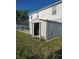 Spacious backyard featuring a storage shed and patio area at 5391 Baldock Ave, Spring Hill, FL 34608
