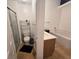 Bright bathroom featuring shower, bathtub, and wooden cabinets at 5391 Baldock Ave, Spring Hill, FL 34608