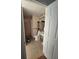 Bathroom with patterned flooring and a toilet with safety bars at 5391 Baldock Ave, Spring Hill, FL 34608