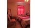 Cozy bedroom with a double bed, side tables, lamp, and hardwood-style flooring at 5391 Baldock Ave, Spring Hill, FL 34608