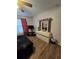 Bedroom with wood-look flooring, a ceiling fan, and a dresser at 5391 Baldock Ave, Spring Hill, FL 34608
