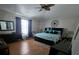 Bright bedroom with a modern bed, stylish decor, and a ceiling fan for added comfort at 5391 Baldock Ave, Spring Hill, FL 34608