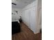 Bedroom with wood-look flooring and ample closet space at 5391 Baldock Ave, Spring Hill, FL 34608