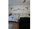 Cozy bedroom featuring two comfortable beds with Paris-themed bedding and stylish decorative wall accents at 5391 Baldock Ave, Spring Hill, FL 34608