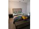Clean bedroom with double bed, side table, and hardwood-style flooring at 5391 Baldock Ave, Spring Hill, FL 34608