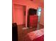 Bedroom featuring a wooden dresser with TV and a walk-in closet at 5391 Baldock Ave, Spring Hill, FL 34608