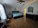 Cozy bedroom featuring a modern bed, a ceiling fan, and stylish decor for a comfortable retreat at 5391 Baldock Ave, Spring Hill, FL 34608