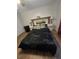 Bedroom features wood-look flooring, queen bed with headboard, and matching bedside tables at 5391 Baldock Ave, Spring Hill, FL 34608