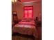 Cozy bedroom with a double bed, side tables, lamp, and hardwood-style flooring at 5391 Baldock Ave, Spring Hill, FL 34608