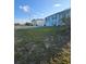 Charming two-story home with light blue exterior paint and a large front lawn at 5391 Baldock Ave, Spring Hill, FL 34608
