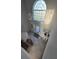 Elegant foyer with a chandelier, stained glass window, and stylish tile flooring at 5391 Baldock Ave, Spring Hill, FL 34608