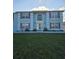Two story home with a well manicured lawn, updated exterior, and double hung windows at 5391 Baldock Ave, Spring Hill, FL 34608