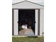 Outdoor shed showcasing ample storage space for tools and equipment, accessible through sliding doors at 5391 Baldock Ave, Spring Hill, FL 34608