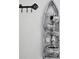 Unique wall decor, including a decorative key rack and a tiered fountain, adding character to the space at 5391 Baldock Ave, Spring Hill, FL 34608