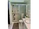Cozy bathroom featuring a glass shower, white tiles, and a modern sink at 5645 97Th N Way, St Petersburg, FL 33708