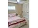 Comfortable bedroom showcasing closet storage, neutral walls, and a ceiling fan at 5645 97Th N Way, St Petersburg, FL 33708