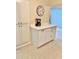 Kitchen area featuring an island with white cabinets, a large pantry, and coffee maker at 5645 97Th N Way, St Petersburg, FL 33708