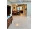 Open-concept living area flowing into the dining room, featuring stylish furnishings and neutral tones at 5645 97Th N Way, St Petersburg, FL 33708