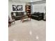Cozy living room showcasing comfortable seating, stylish decor, and natural light from large windows at 5645 97Th N Way, St Petersburg, FL 33708