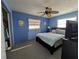 Bedroom with light blue walls, ceiling fan and closet space at 5930 Bahama N Way, St Pete Beach, FL 33706