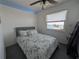 Bedroom with ceiling fan boasting scenic waterfront views at 5930 Bahama N Way, St Pete Beach, FL 33706