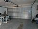 Spacious garage with a modern garage door and ample room for parking, storage, and potential workspace at 5930 Bahama N Way, St Pete Beach, FL 33706