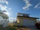 Two story home with attached garage and view of the lake at 5930 Bahama N Way, St Pete Beach, FL 33706