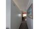 Hallway view leading to a dining area with a table and chairs and tiled floors at 5930 Bahama N Way, St Pete Beach, FL 33706