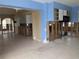 Open concept kitchen with blue cabinets, tile flooring, and microwave at 5930 Bahama N Way, St Pete Beach, FL 33706