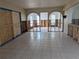 Spacious living area with arched doorways, tile flooring, and framing ready for customization and finishing touches at 5930 Bahama N Way, St Pete Beach, FL 33706