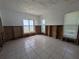Spacious living room featuring tile floors, large windows with water views, and studs ready for renovations at 5930 Bahama N Way, St Pete Beach, FL 33706