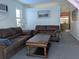 Cozy living room featuring comfortable seating, a coffee table, and bright natural light from the window at 5930 Bahama N Way, St Pete Beach, FL 33706