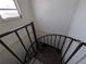 Spiral staircase leading to the lower level at 5930 Bahama N Way, St Pete Beach, FL 33706
