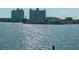 A view of the canal with high-rise apartment buildings in the background at 5930 Bahama N Way, St Pete Beach, FL 33706